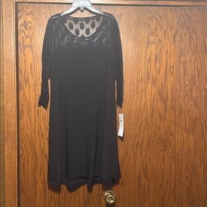 Stylish Nina Leonard Black Dress with Sheer Polka Dot Design